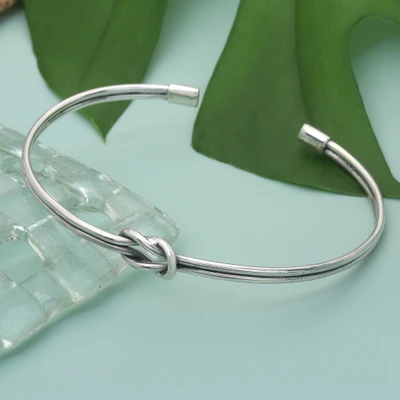 Sterling silver cuff pendant bracelet, 'Eternal Knot' - Modern Silver Cuff Bracelet with Infinity Symbol Knot Motif