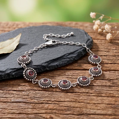 Garnet link bracelet, 'Carousel of Passions' - Balinese Folk Art-Themed Natural Round Garnet Link Bracelet