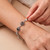 Garnet link bracelet, 'Carousel of Passions' - Balinese Folk Art-Themed Natural Round Garnet Link Bracelet (image 2j) thumbail
