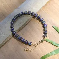 Gold-accented lapis lazuli beaded link bracelet, 'Midnight Margarita' - 18k Gold-Accented Bracelet with Knotted Lapis Lazuli Gems