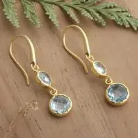 Gold-plated blue topaz dangle earrings, 'Soothing Glamour' - Gold-Plated Dangle Earrings with 4 Faceted Blue Topaz Gems
