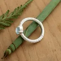 Blue topaz single stone ring, 'Shining Sky' - Textured Silver Single Stone Ring with Round Blue Topaz Gem