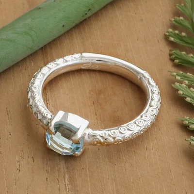 Blue topaz single stone ring, 'Shining Sky' - Textured Silver Single Stone Ring with Round Blue Topaz Gem
