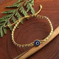Gold-accented aquamarine and resin macrame beaded pendant bracelet, 'Perceptive Eye' - Turkish Eye-Themed Gold-Accented Aquamarine Resin Bracelet