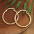 Gold-plated hoop earrings, 'Glowing Essentials' - 18k Gold-Plated Brass Hoop Earrings with Lustrous Finish (image 2d) thumbail