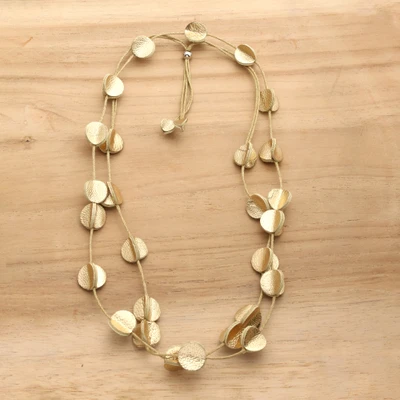 Leather long station necklace, 'Disco Glam' - Golden-Toned Disc-Themed Leather Long Station Necklace