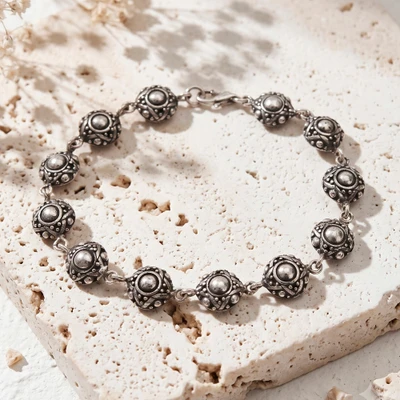 Sterling silver link bracelet, 'Island Chakras' - Folk Art Polished and Oxidized Link Bracelet Made in Bali