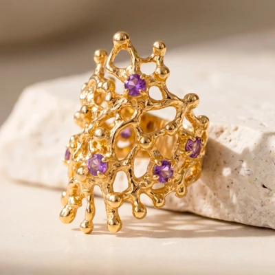 Gold-plated amethyst cocktail ring, 'Wise Beginnings' - Faceted Amethyst and 18k Gold Plated Brass Cocktail Ring