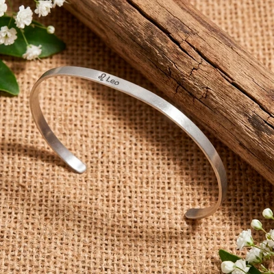 Sterling silver cuff bracelet, 'Leo Prestige' - Polished Sterling Silver Cuff Bracelet with Leo Zodiac Sign