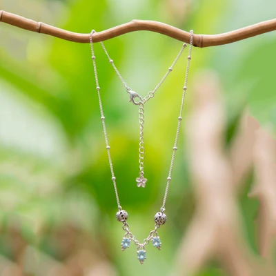 Blue topaz pendant necklace, 'Orbs and Drops' - Silver Pendant Necklace with Three Blue Topaz Gem Charms