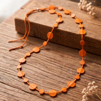 Leather station necklace, 'Moonlit Orange' - Orange-Palette Leather Station Necklace with Round Pendants