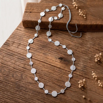 Leather station necklace, 'Moonlit Silver' - Silver-Toned Leather Station Necklace with Round Pendants