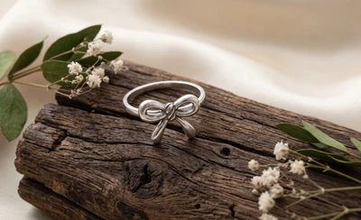 Sterling silver stud earrings, 'Radiant Ribbon' - Ribbon-Inspired Whimsical Textured Silver Stud Earrings