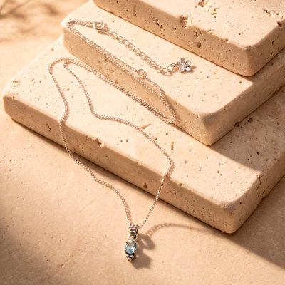 Blue topaz pendant necklace, 'Dainty Crown' - Blue Topaz Silver Pendant Necklace with Adjustable Length