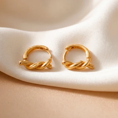 Gold-plated hoop earrings, 'Gilded Knot' - Polished Knot-Shaped 18k Gold-Plated Brass Hoop Earrings