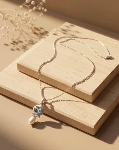 Blue topaz and cultured pearl pendant necklace, 'Celestial Tide' - One-Carat Blue Topaz and Cultured Pearl Pendant Necklace