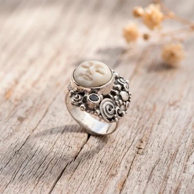 Blue topaz cocktail ring, 'Swirling Moon' - Blue Topaz Silver Cocktail Ring with Hand-Carved Moon Motif