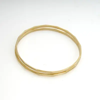 Gold-plated bangle bracelets, 'Shimmering Geometry' (pair) - Pair of Geometric 18k Gold-Plated Silver Bangle Bracelets