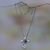 Garnet necklace, 'Blossom Cross' - Garnet necklace thumbail