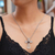 Garnet necklace, 'Blossom Cross' - Garnet necklace