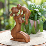 Wood sculpture, 'Mother's Love' - Suar Wood Family Sculpture