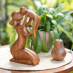 Wood sculpture, 'Mother's Love' - Suar Wood Family Sculpture