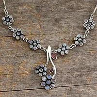 Moonstone and garnet floral necklace, 'White Marigold' - Moonstone and garnet floral necklace