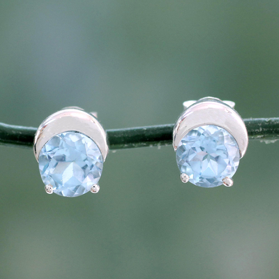 Blue topaz stud earrings, 'Twinkling Moons' - Sterling Silver and Blue Topaz Stud Earrings from India