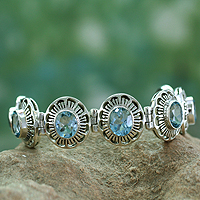 Topaz flower bracelet, 'Sky Blossom' - Handcrafted Fair Trade Blue Topaz and Sterling Link Bracelet