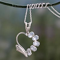 Blue topaz heart necklace, 'Winged Heart' - Blue Topaz Heart Necklace