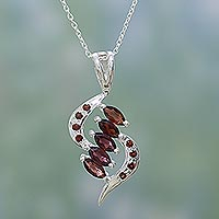 Garnet pendant necklace, 'Crimson Twirl' - Garnet in Sterling Silver Necklace Fair Trade Jewellery
