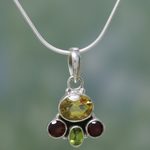 Garnet and citrine pendant necklace, 'Cosmic Harmony' - Handcrafted Sterling Silver Multigem Necklace