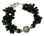 Onyx torsade bracelet, 'Midnight Tears' - Artisan Crafted Black Onyx Torsade Bracelet with Silver