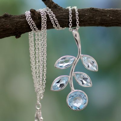 Blue topaz pendant necklace, 'Azure Leaves' - Unique Blue Topaz and Sterling Silver Pendant Necklace