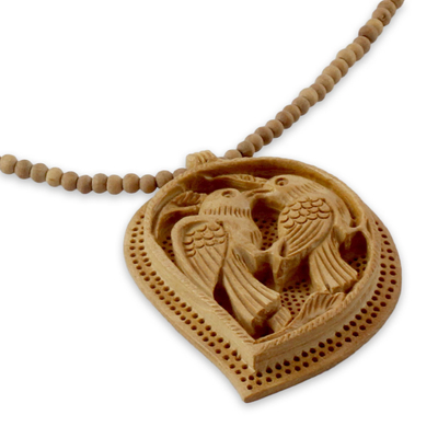 Wood pendant necklace, 'Love Takes Wing' - Hand Carved Wood Necklace from India Jewelry Collection