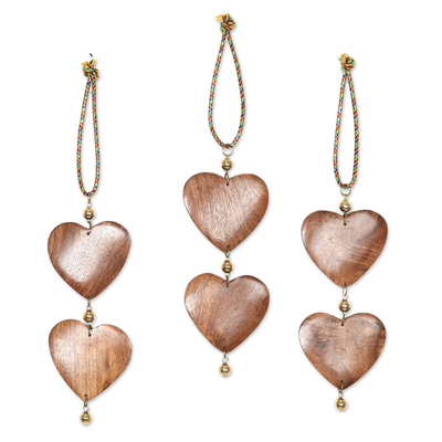 Wood ornaments, 'Cheerful Hearts' (set of 3) - Fair Trade Hand-carved Wood Ornaments (set of 3)