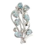 Blue topaz floral brooch pin, 'Sky Bouquet' - Fair Trade Blue Topaz and Sterling Silver Brooch Pin