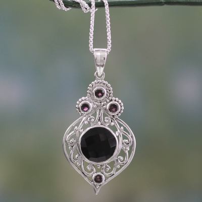 Onyx and garnet pendant necklace, 'Delhi Hope' - Fair Trade Onyx and Garnet Sterling Silver Necklace
