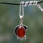 Carnelian pendant necklace, 'Solar Charm' - Sterling Silver and Carnelian Pendant Necklace from India