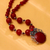 Carnelian and garnet flower necklace, 'Mystical Blossom' - Handcrafted Floral Pendant Necklace Carnelian and Garnet