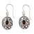Garnet dangle earrings, 'Coy Crimson' - Flower Themed Garnet Dangle Earrings in Sterling Silver