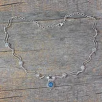 Blue topaz and chalcedony pendant necklace, 'Celestial Trail' - Blue Topaz and Chalcedony Silver Pendant Necklace