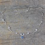 Blue topaz and chalcedony pendant necklace, 'Celestial Trail' - Blue Topaz and Chalcedony Silver Pendant Necklace