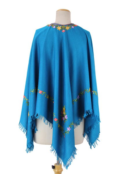 Wool poncho, 'Colorful Affair' - Artisan Crafted 100% Wool Blue Poncho with Floral Embroidery