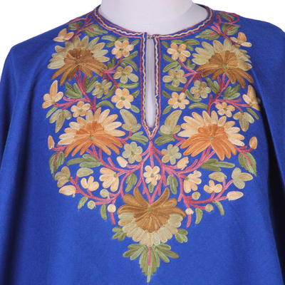 Wool poncho, 'Majestic Garden' - Indian 100% Wool Poncho in Royal Blue with Aari Embroidery