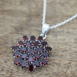 Garnet pendant necklace, 'Red Sunflower' - Hand Made Sterling Silver Garnet Pendant Necklace India