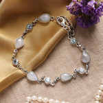 Rainbow moonstone and blue topaz link bracelet, 'Misty Sky' - Blue Topaz and Rainbow Moonstone Gemstone Station Bracelet