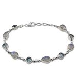 Rainbow moonstone and blue topaz link bracelet, 'Misty Sky' - Blue Topaz and Rainbow Moonstone Gemstone Station Bracelet