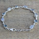 Rainbow moonstone and blue topaz link bracelet, 'Misty Sky' - Blue Topaz and Rainbow Moonstone Gemstone Station Bracelet