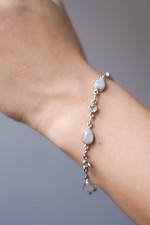Rainbow moonstone and blue topaz link bracelet, 'Misty Sky' - Blue Topaz and Rainbow Moonstone Gemstone Station Bracelet